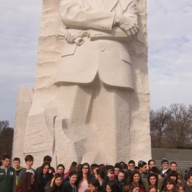A school group poses in front of the MLK Monument